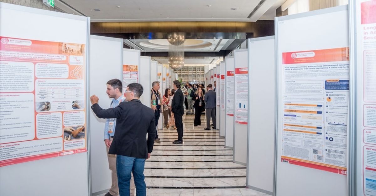Picture of people looking at abstract posters at a WFH Congress.